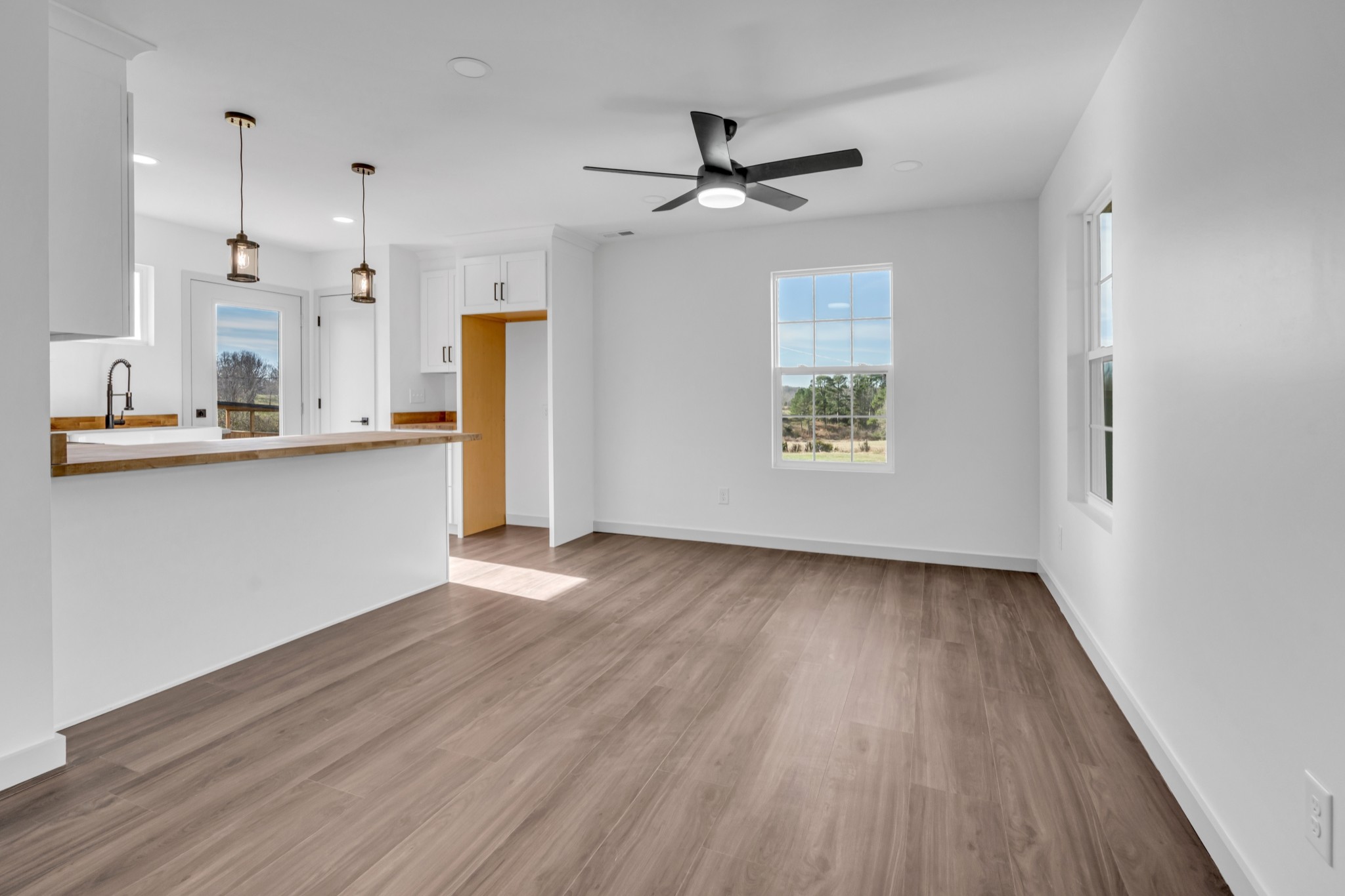 7159 C C C Road Fairview, TN 37062 - Photo 51 of 83 a view of a kitchen with a dishwasher a kitchen island hardwood floor and a window