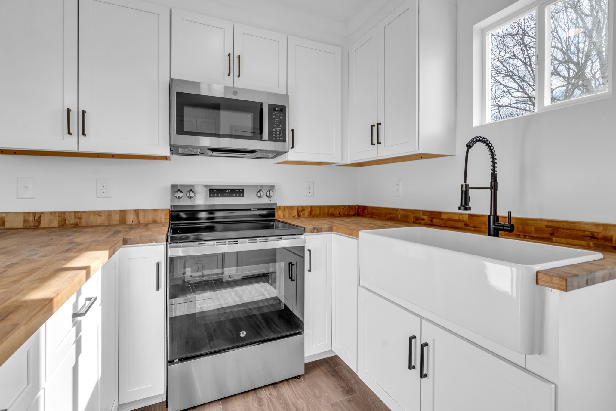 7159 C C C Road Fairview, TN 37062 - Photo 55 of 83 a kitchen with granite countertop a stove and a sink