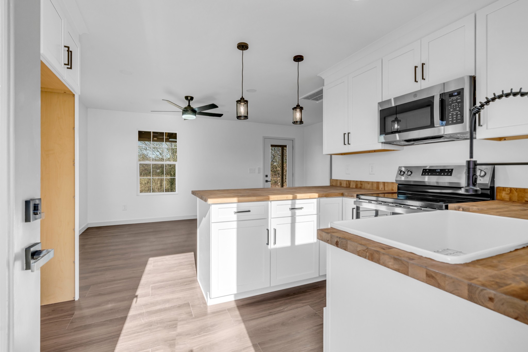 7159 C C C Road Fairview, TN 37062 - Photo 56 of 83 a kitchen with stainless steel appliances granite countertop a sink and a stove