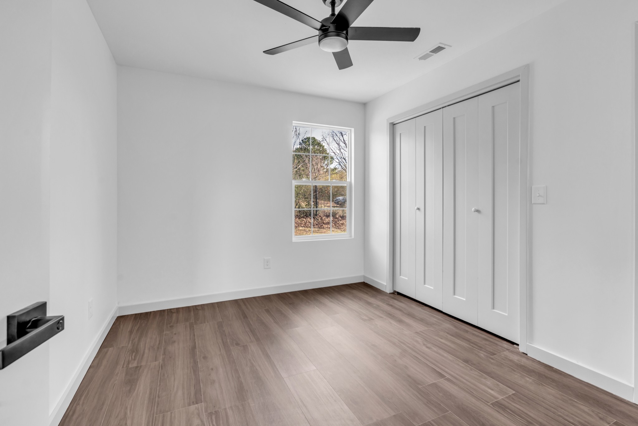 7159 C C C Road Fairview, TN 37062 - Photo 60 of 83 wooden floor in an empty room with a window