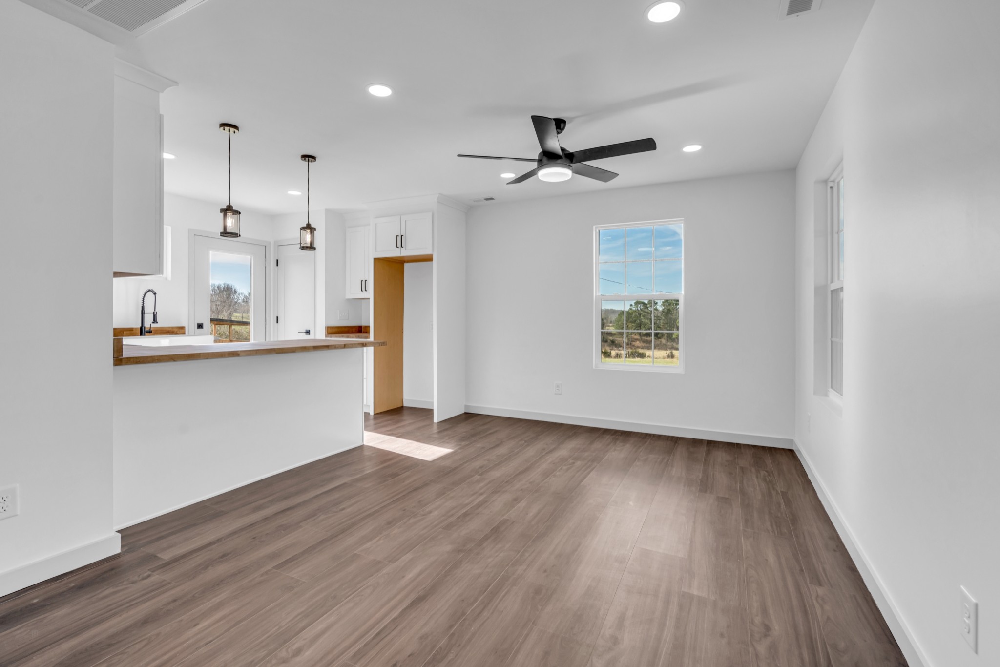 7159 C C C Road Fairview, TN 37062 - Photo 67 of 83 a view of an empty room with wooden floor and a window