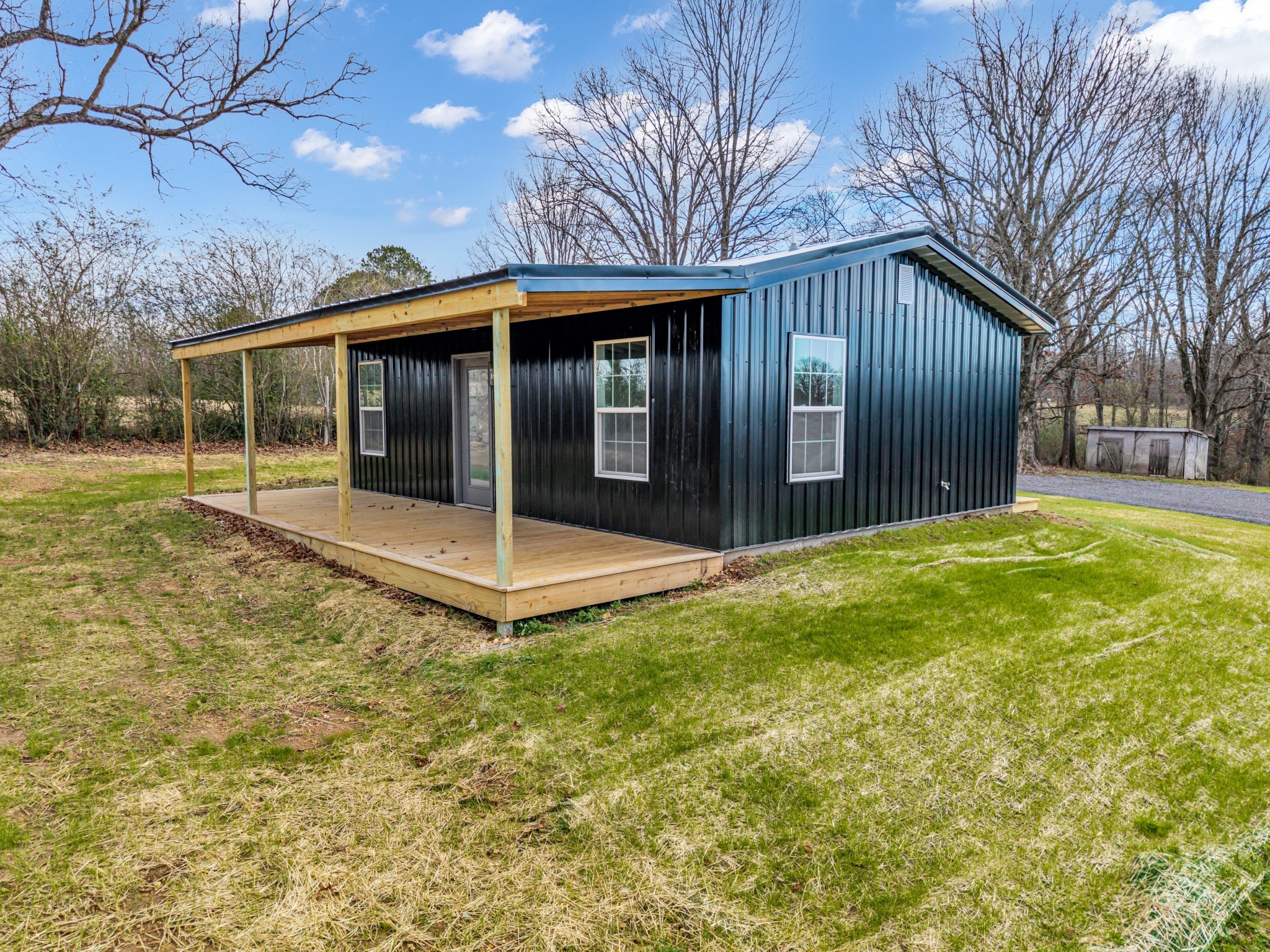 7159 C C C Road Fairview, TN 37062 - Photo 76 of 83 a view of a house with backyard and porch