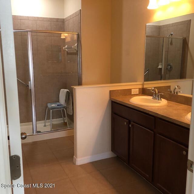 3731 Funston Circle Melbourne, FL 32940 - Photo 19 of 29 a bathroom with a sink and a mirror