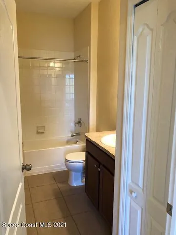 a bathroom with a shower and a toilet