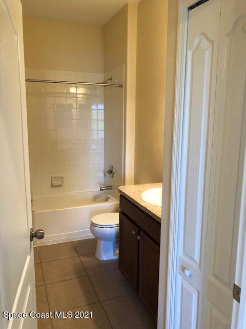 3731 Funston Circle Melbourne, FL 32940 - Photo 23 of 29 a bathroom with a granite countertop bathtub shower sink vanity and toilet