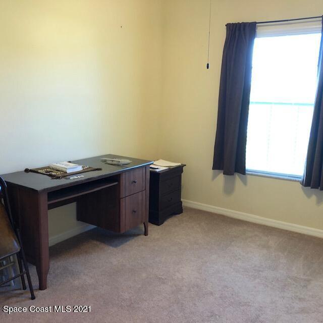 3731 Funston Circle Melbourne, FL 32940 - Photo 25 of 29 a room with a table and a window