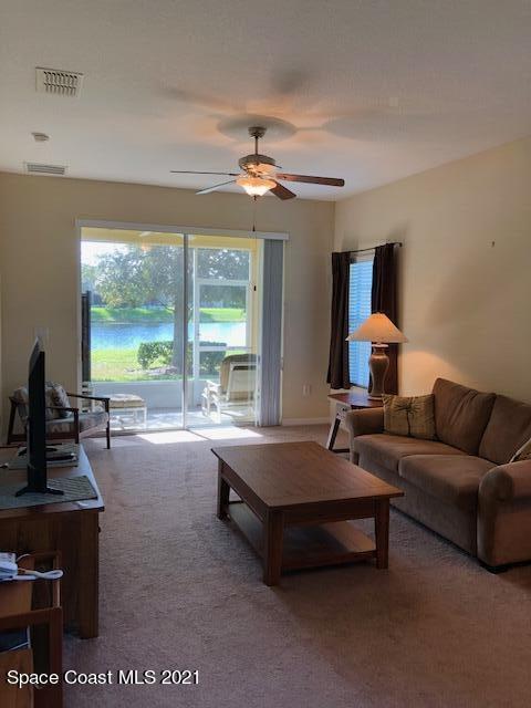 3731 Funston Circle Melbourne, FL 32940 - Photo 8 of 29 a living room with furniture and a flat screen tv