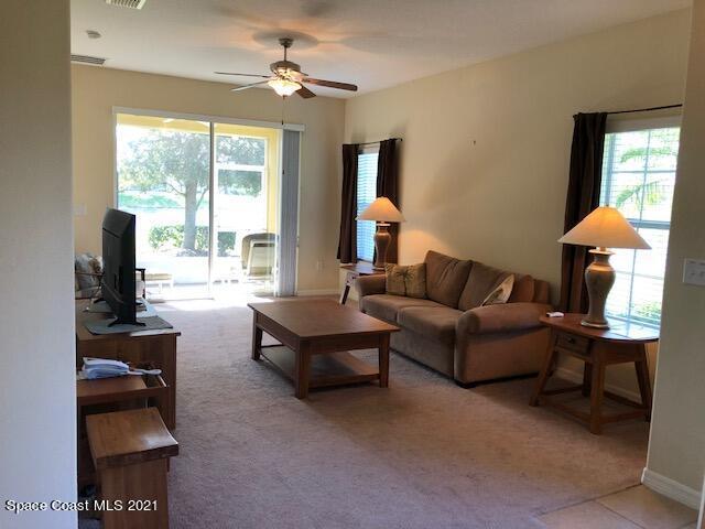 3731 Funston Circle Melbourne, FL 32940 - Photo 9 of 29 a living room with furniture and a window