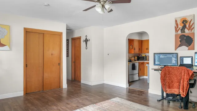 a view of living room with furniture and wooden floor