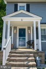 a front view of a house with a porch