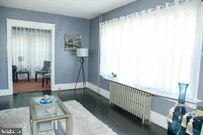 a view of hall way with furniture