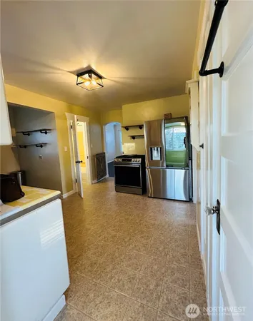 a view of a kitchen with electric appliances
