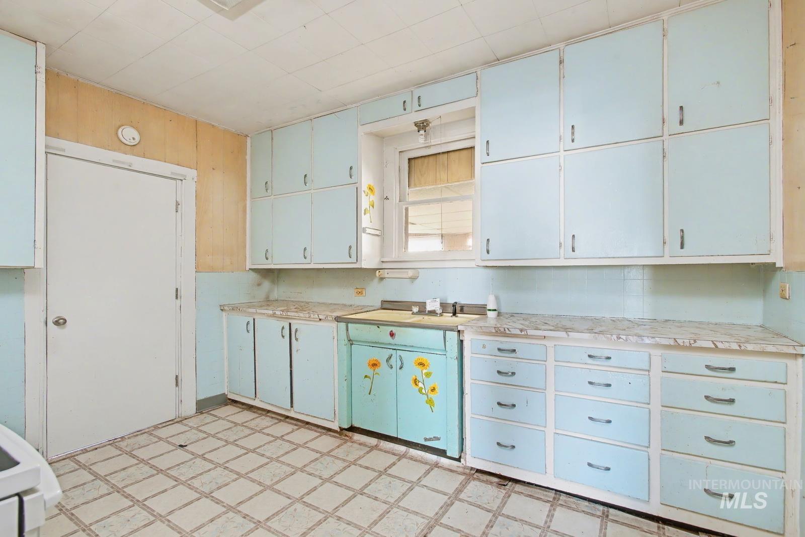 332 High Street Pomeroy, WA 99347 - Photo 10 of 23 Kitchen featuring light floors, light countertops, and white cabinetry