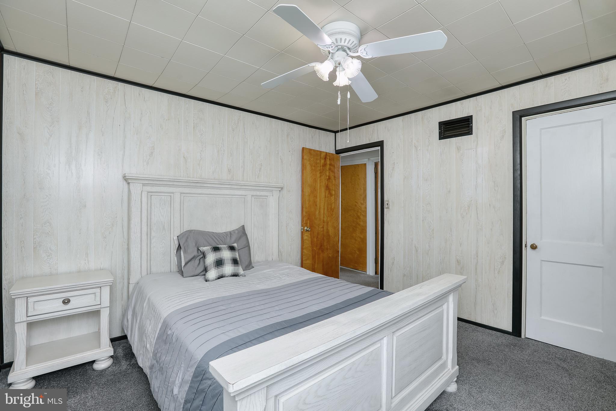 183 Franklyn Road Ewing, NJ 08628 - Photo 12 of 20 a bedroom with a bed and a chandelier