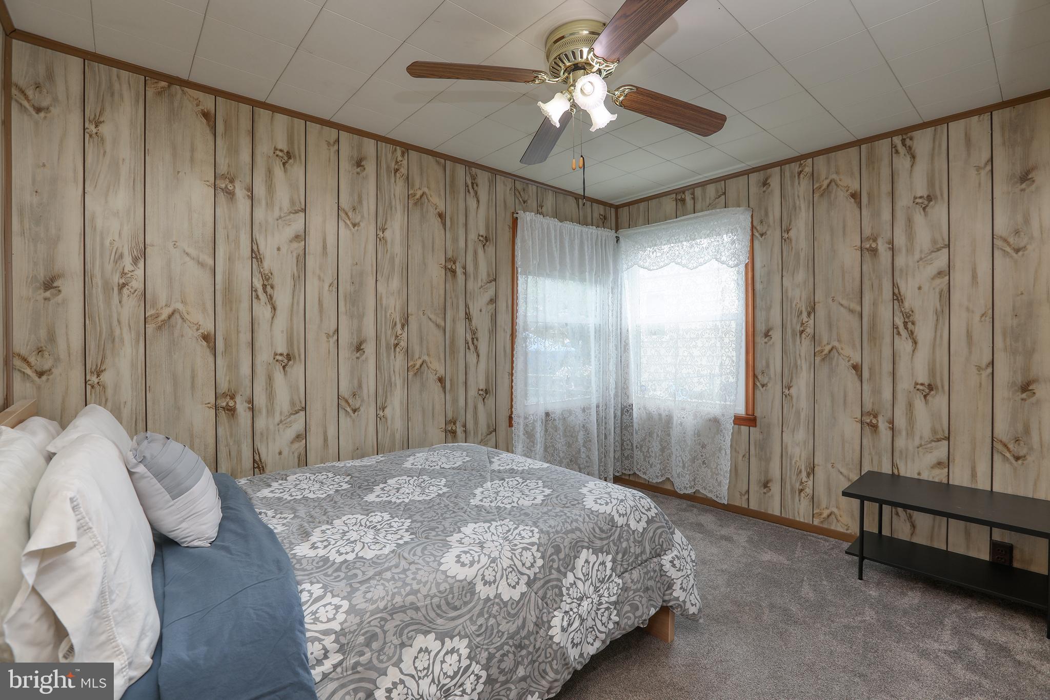 183 Franklyn Road Ewing, NJ 08628 - Photo 13 of 20 a bedroom with a bed and a chandelier