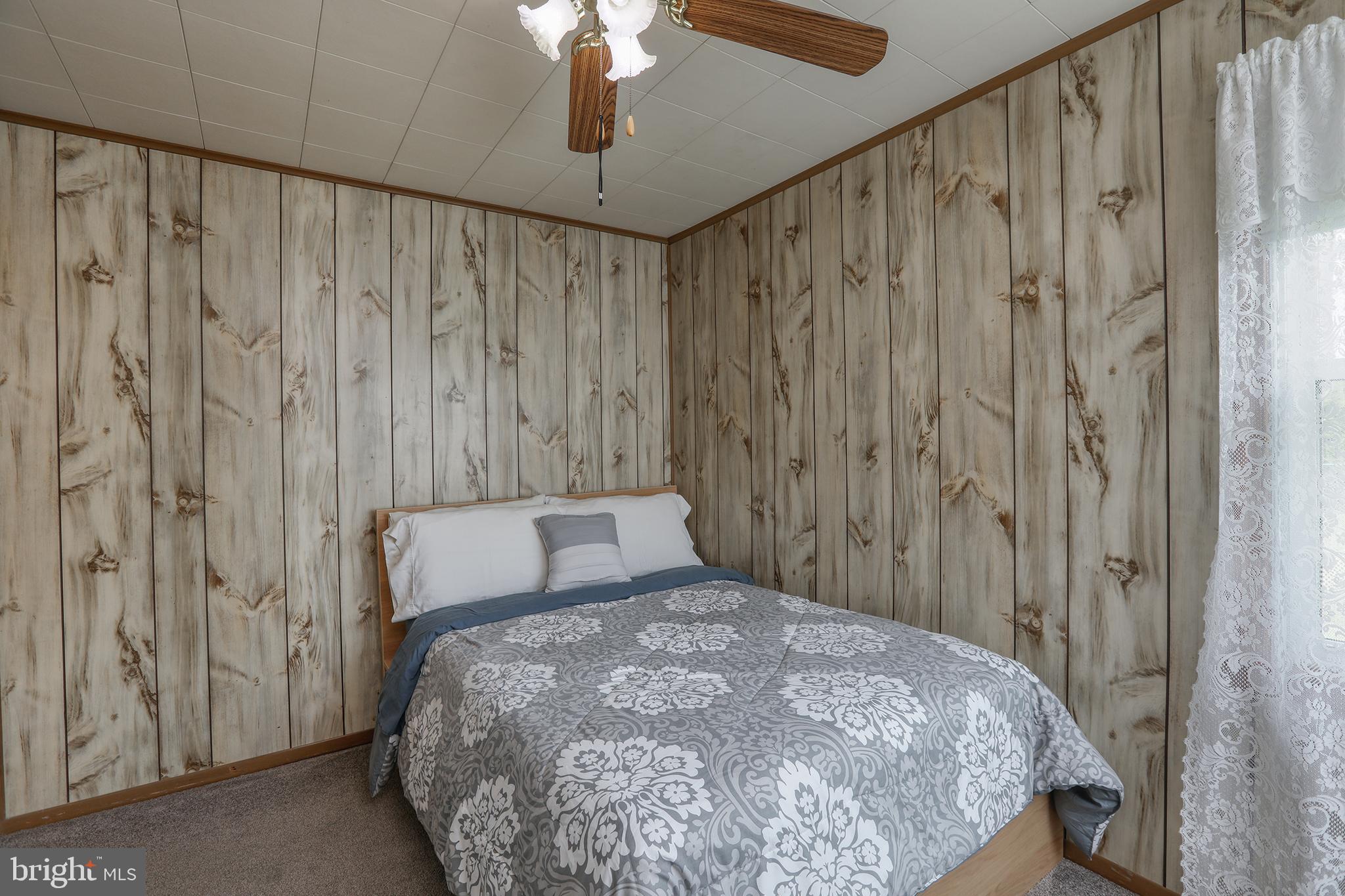 183 Franklyn Road Ewing, NJ 08628 - Photo 14 of 20 a bedroom with a bed and a chandelier fan