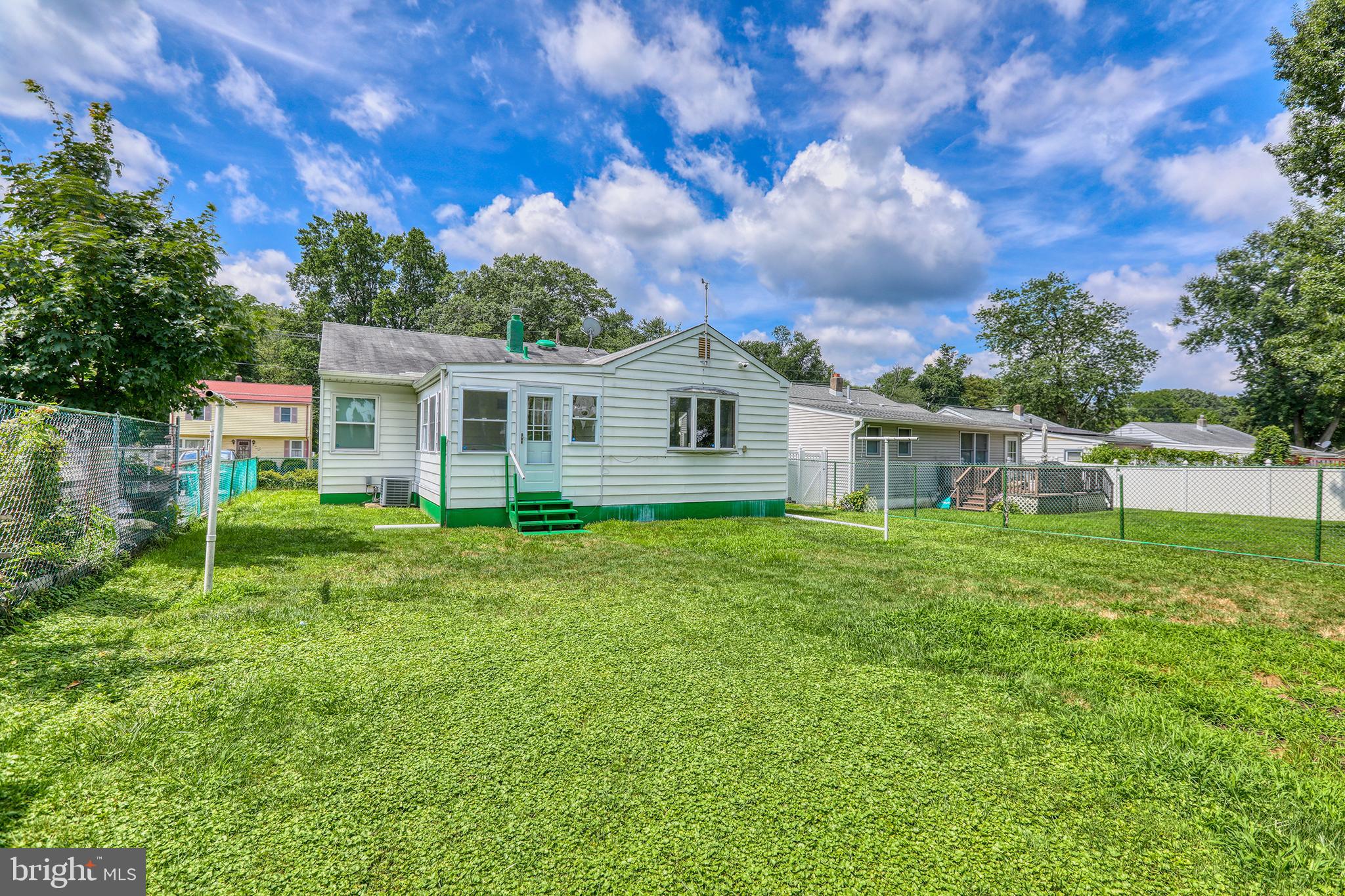 183 Franklyn Road Ewing, NJ 08628 - Photo 19 of 20 a view of a house with backyard sitting area and garden
