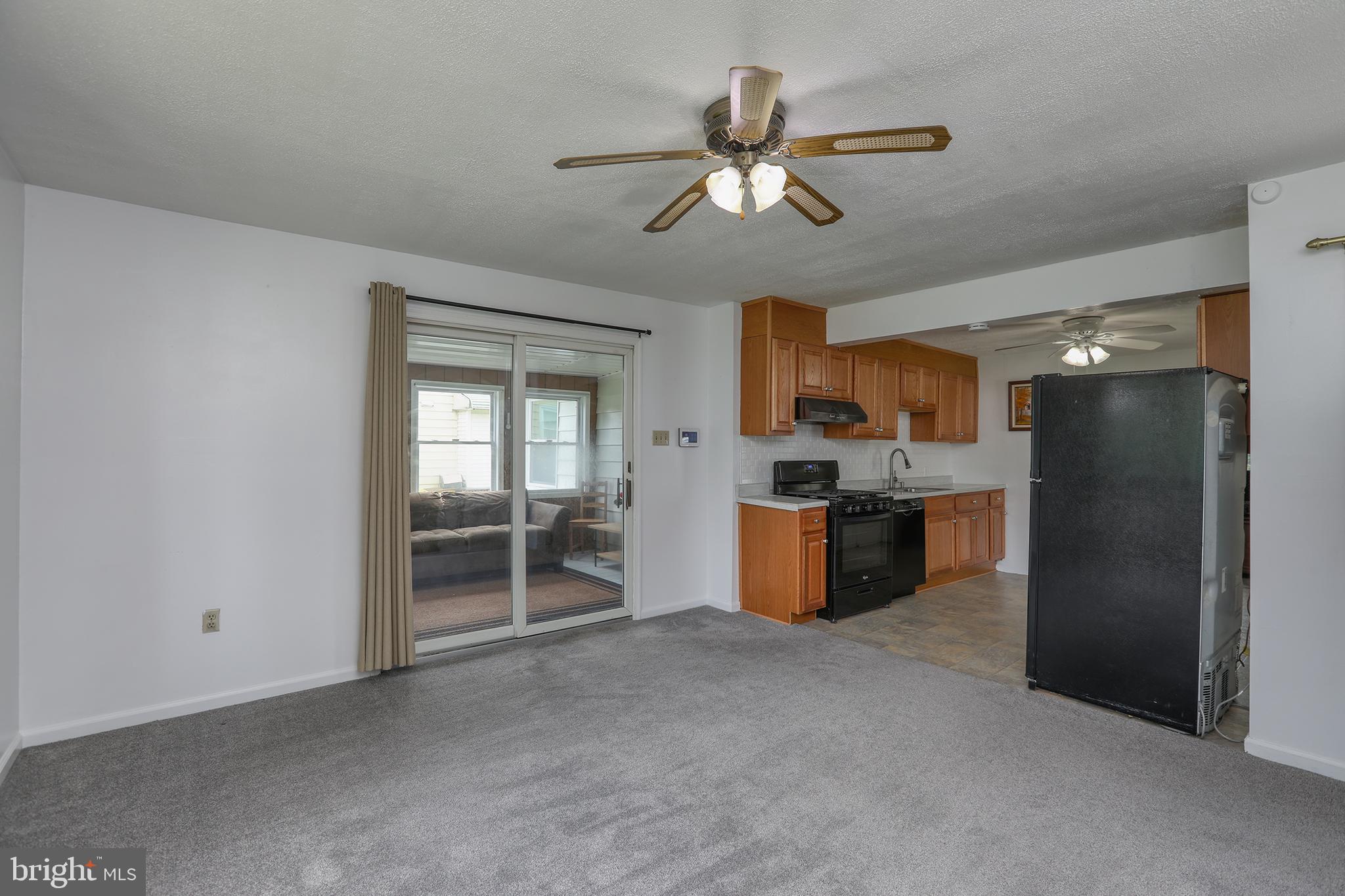 183 Franklyn Road Ewing, NJ 08628 - Photo 8 of 20 a kitchen with stainless steel appliances kitchen island a refrigerator sink and cabinets