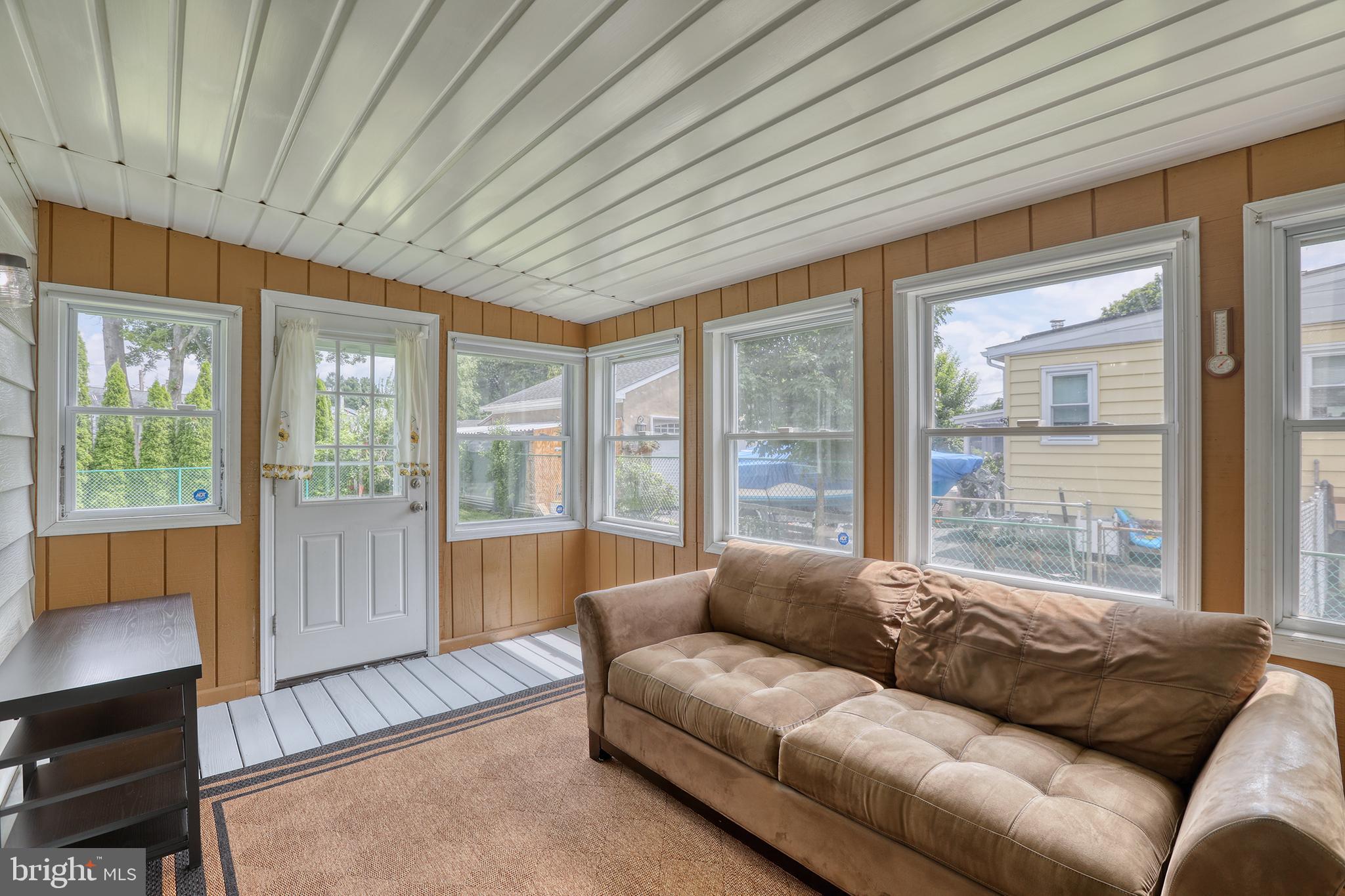 183 Franklyn Road Ewing, NJ 08628 - Photo 9 of 20 a living room with furniture and a large window