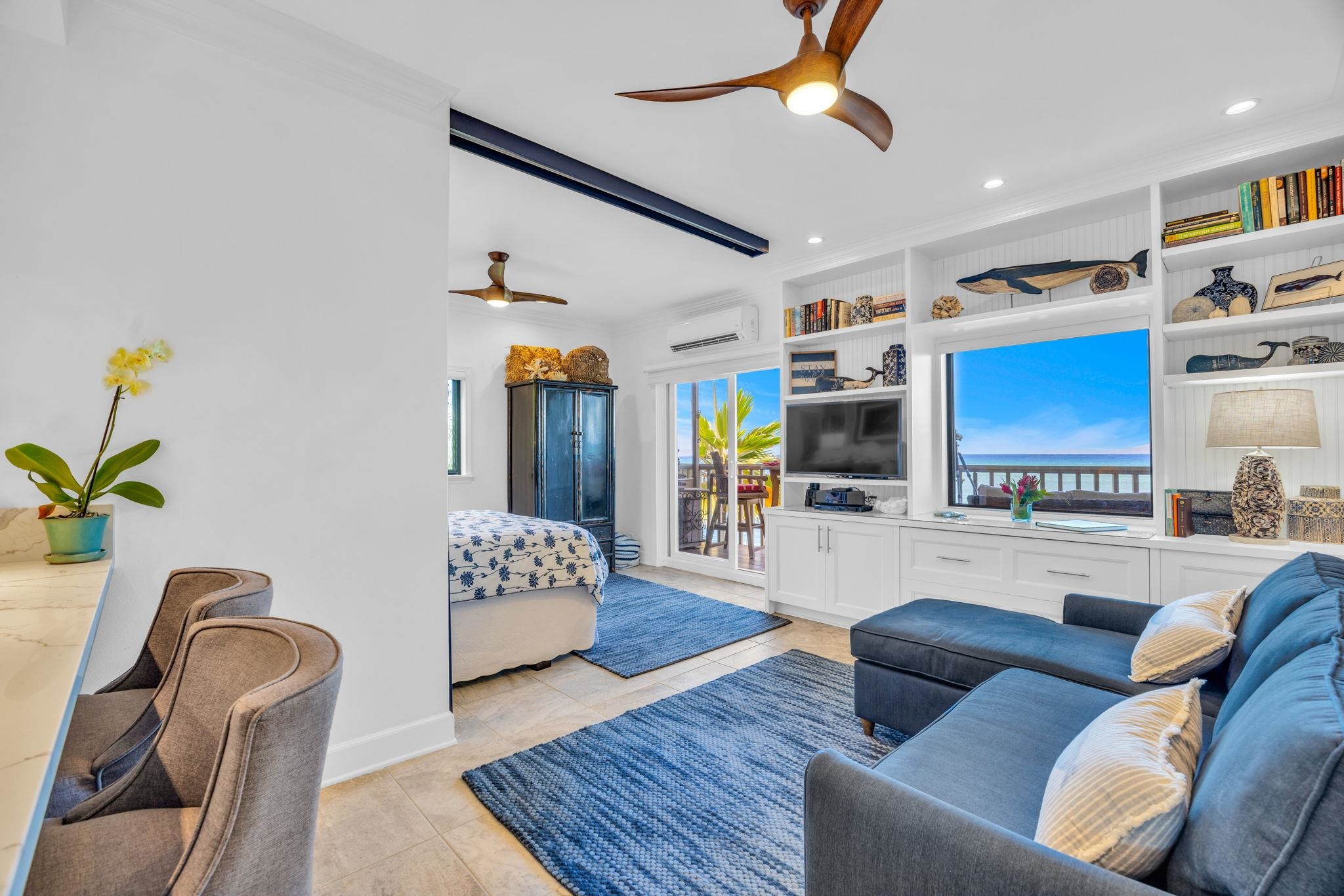 4435 Lower Honoapiilani Road, Unit 203 Lahaina, HI 96761 - Photo 11 of 32 a living room with furniture and a flat screen tv