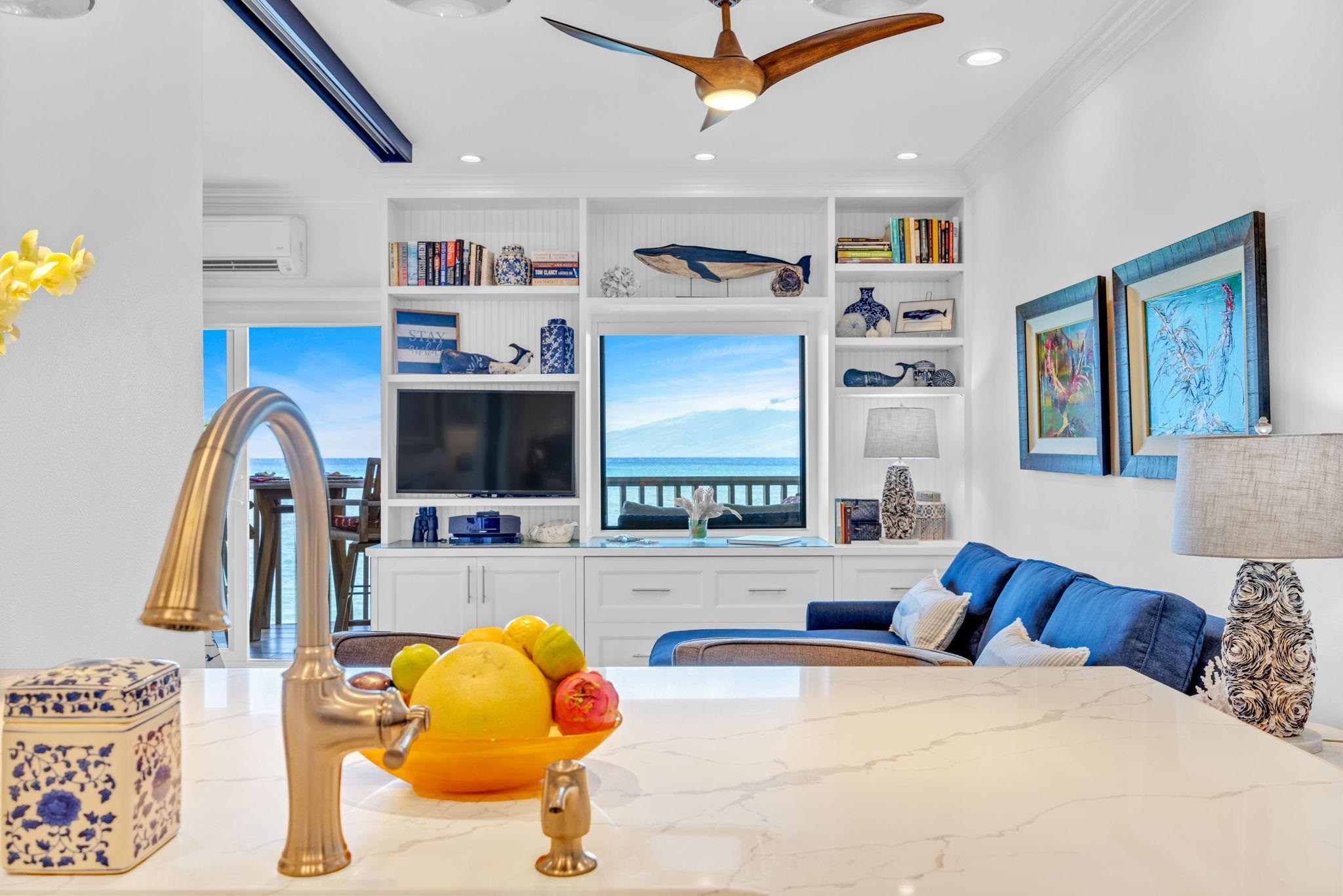 4435 Lower Honoapiilani Road, Unit 203 Lahaina, HI 96761 - Photo 15 of 32 a bedroom with furniture and a flat screen tv