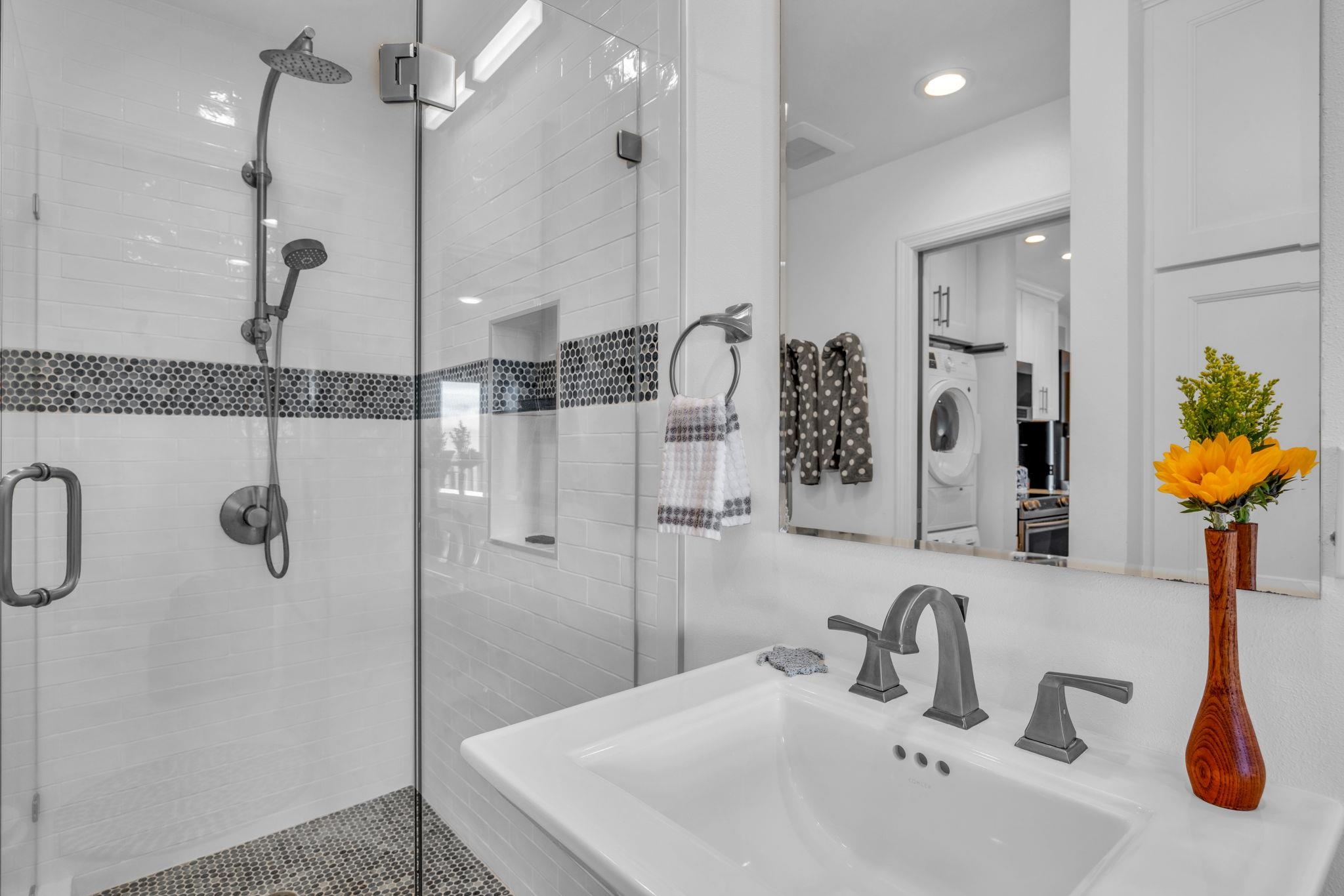 4435 Lower Honoapiilani Road, Unit 203 Lahaina, HI 96761 - Photo 16 of 32 a bathroom with a sink and a mirror