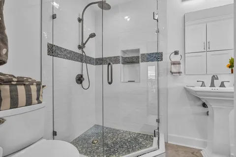 a bathroom with a sink and mirror