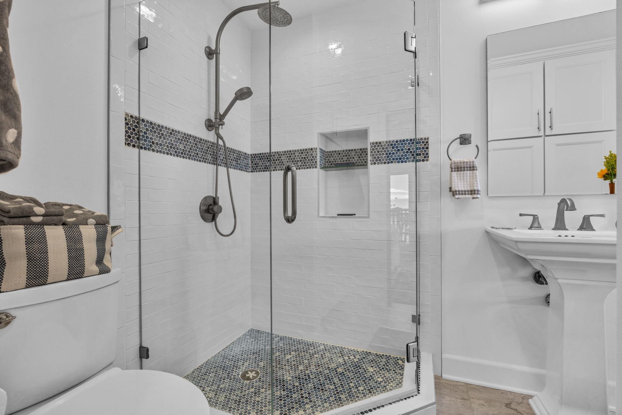 4435 Lower Honoapiilani Road, Unit 203 Lahaina, HI 96761 - Photo 24 of 32 a bathroom with a sink a toilet and shower