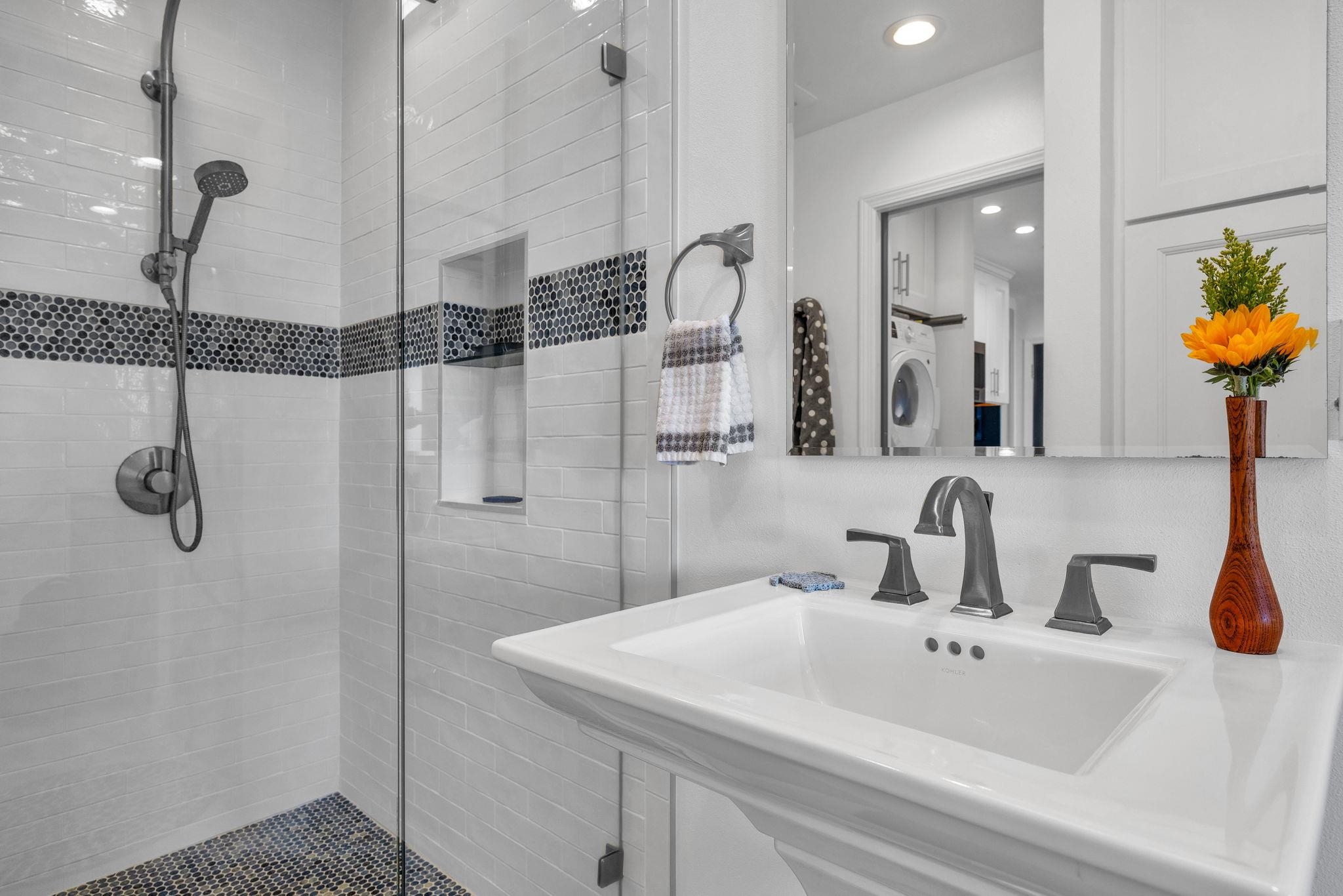 4435 Lower Honoapiilani Road, Unit 203 Lahaina, HI 96761 - Photo 25 of 32 a bathroom with a sink and mirror