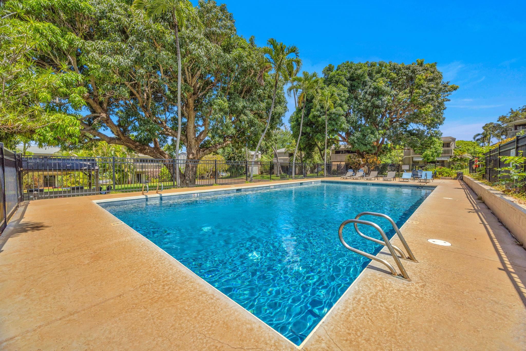 4435 Lower Honoapiilani Road, Unit 203 Lahaina, HI 96761 - Photo 27 of 32 a view of a swimming pool with a yard