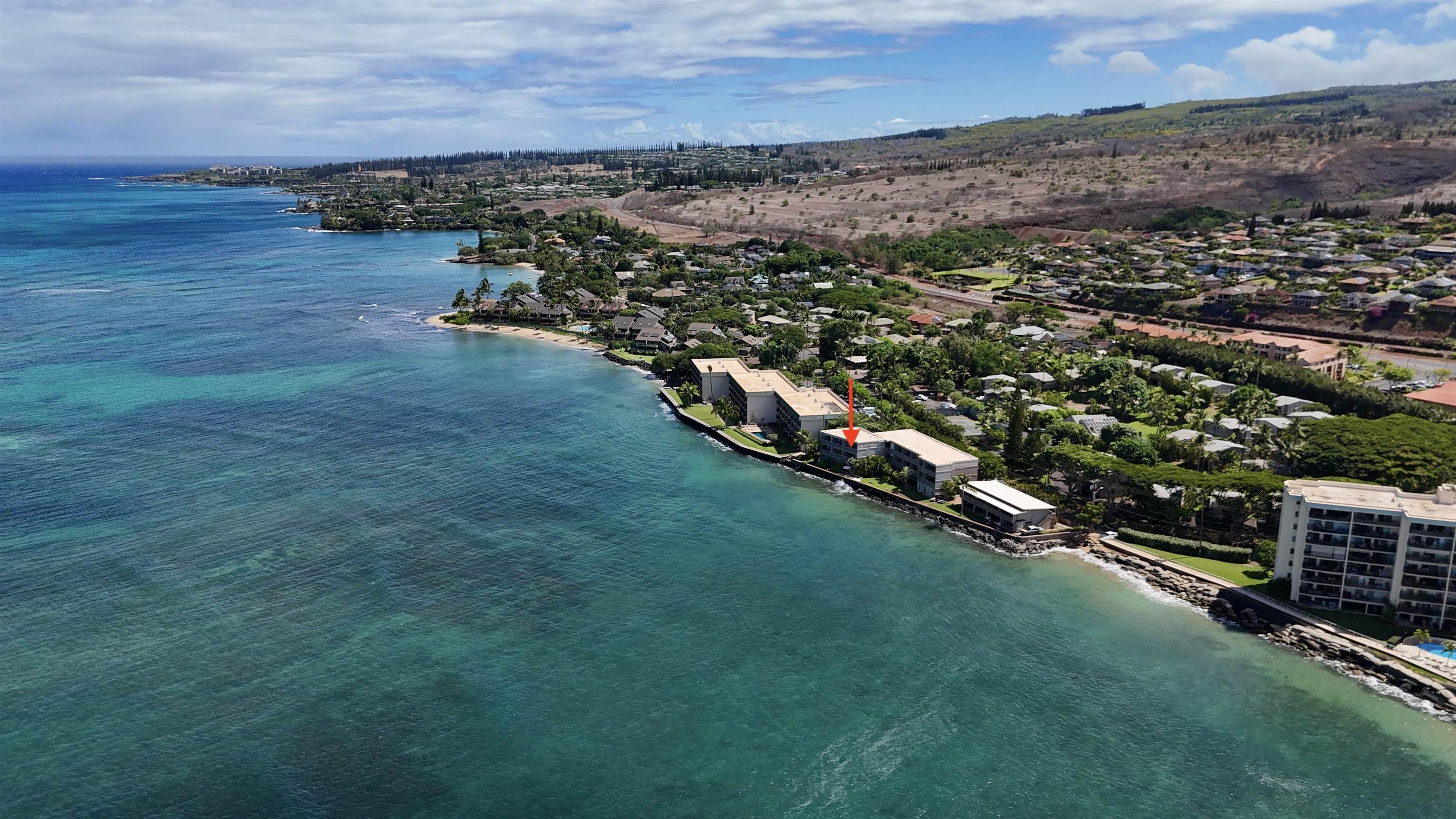 4435 Lower Honoapiilani Road, Unit 203 Lahaina, HI 96761 - Photo 4 of 32 an aerial view of residential houses with outdoor space