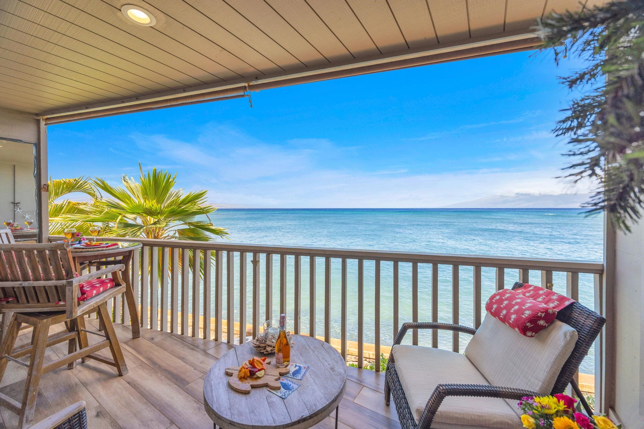 4435 Lower Honoapiilani Road, Unit 203 Lahaina, HI 96761 - Photo 8 of 32 a view of a chairs and tables in the patio