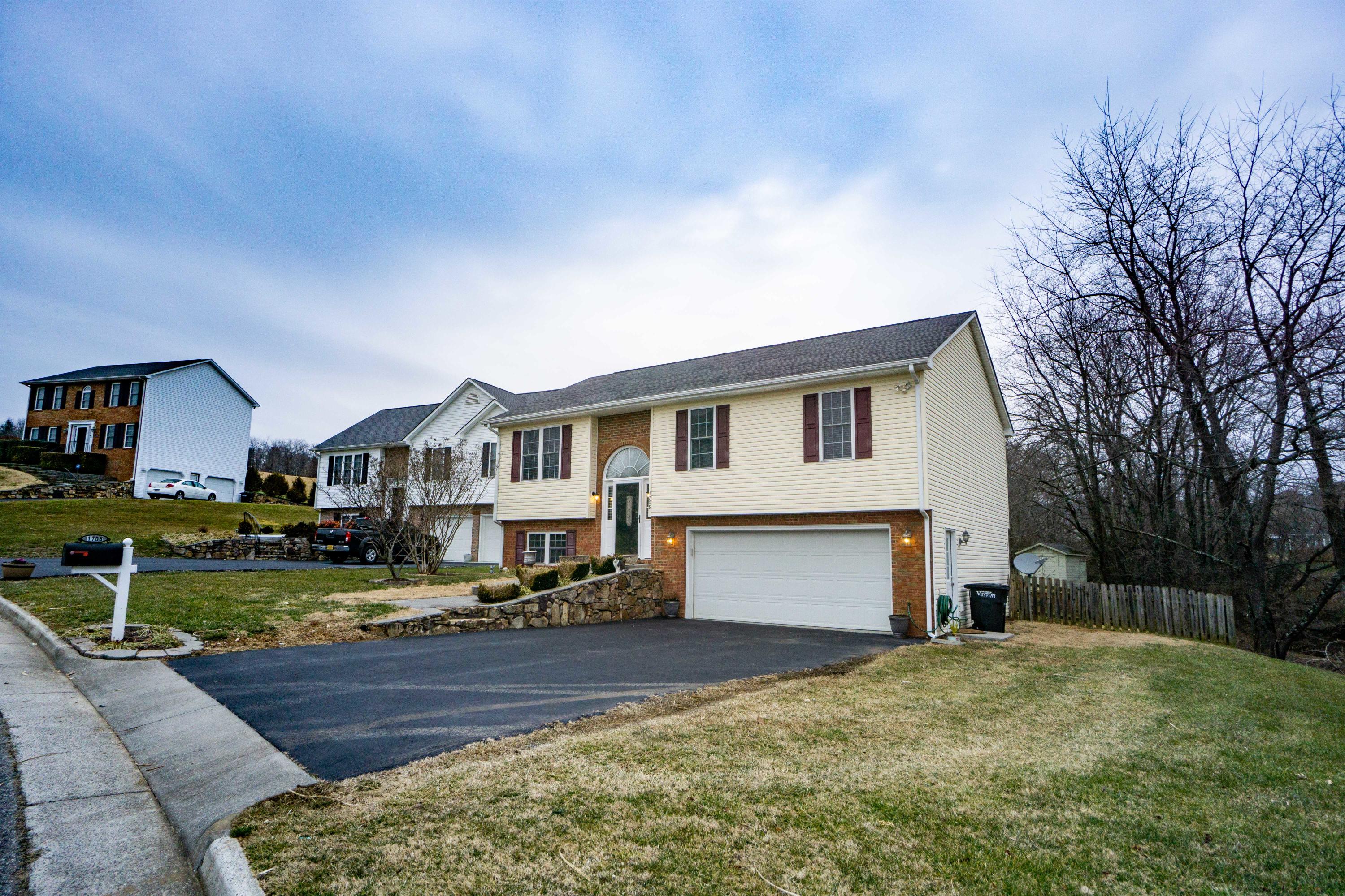 1708 Meadows Road Vinton, VA 24179 - Photo 3 of 31 a front view of a house with a yard