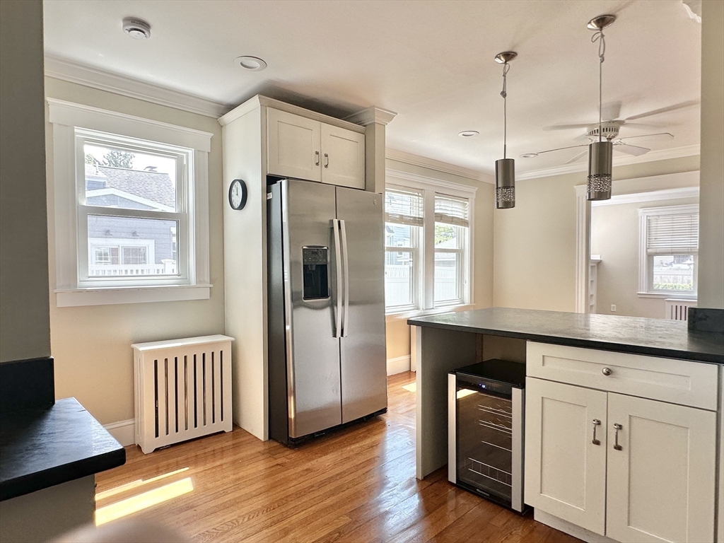 8 A Mellon Road Wellesley, MA 02482 - Photo 2 of 22 a kitchen with stainless steel appliances a refrigerator a sink dishwasher a oven with white cabinets and wooden floor