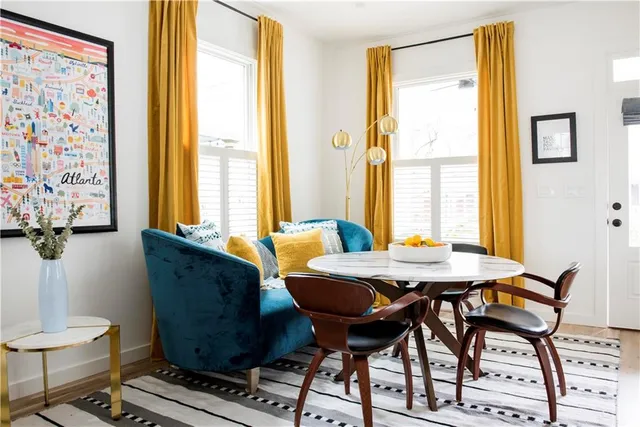 a dining room with furniture and window