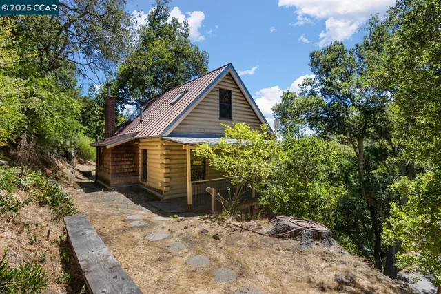 a view of empty room with a fireplace