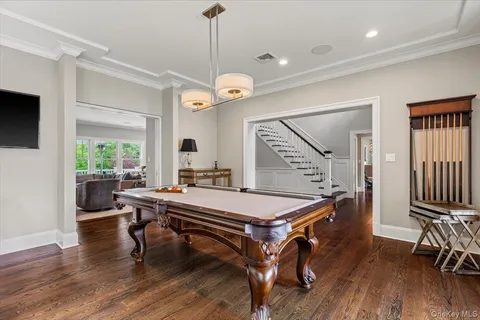 a room with lots of furniture and wooden floor