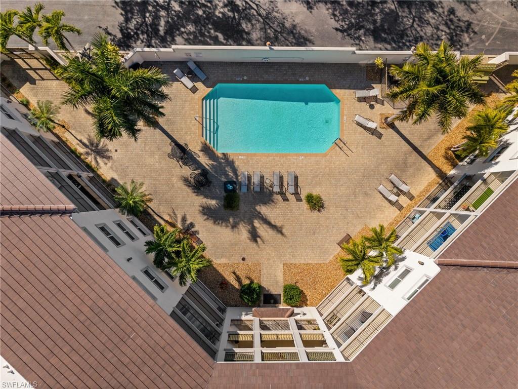 1100 Pine Ridge Road, Unit B103 Naples, FL 34108 - Photo 34 of 38 an aerial view of a house with a yard and potted plants