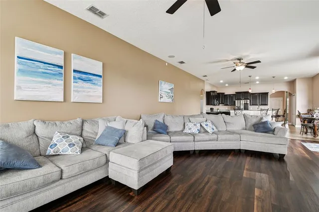 a bathroom with a sink a toilet a mirror and a window