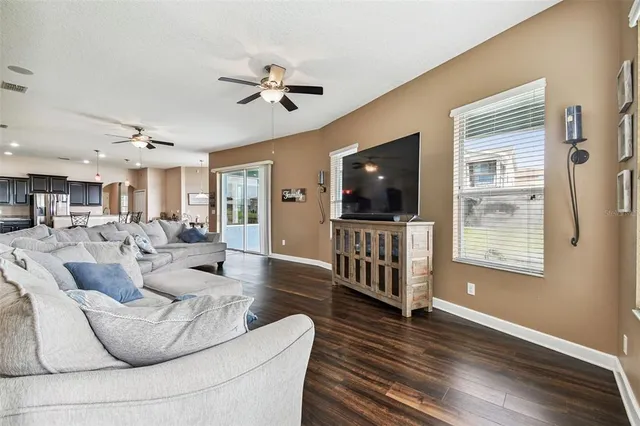 a view of a livingroom with furniture and a window