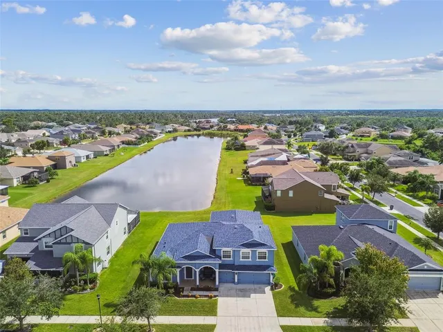 a kitchen with stainless steel appliances granite countertop a refrigerator and a stove