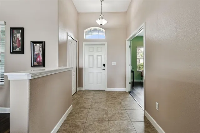 a bathroom with a granite countertop toilet and a shower