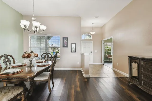 a front view of house with yard and ocean