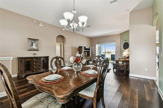 a view of swimming pool with outdoor seating and barbeque in the back