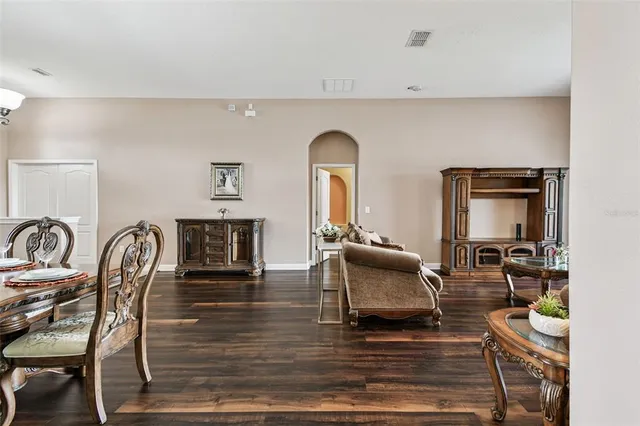 an aerial view of a house with a garden and lake view