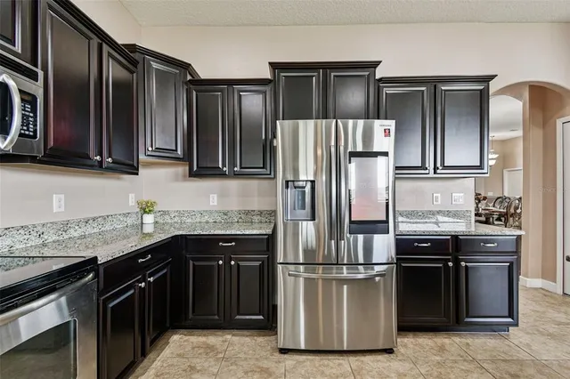 a living room with furniture and a ceiling fan