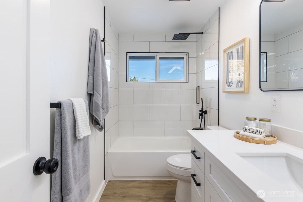1103 Vashon Court Northeast Renton, WA 98059 - Photo 12 of 26 a bathroom with a sink a toilet and shower