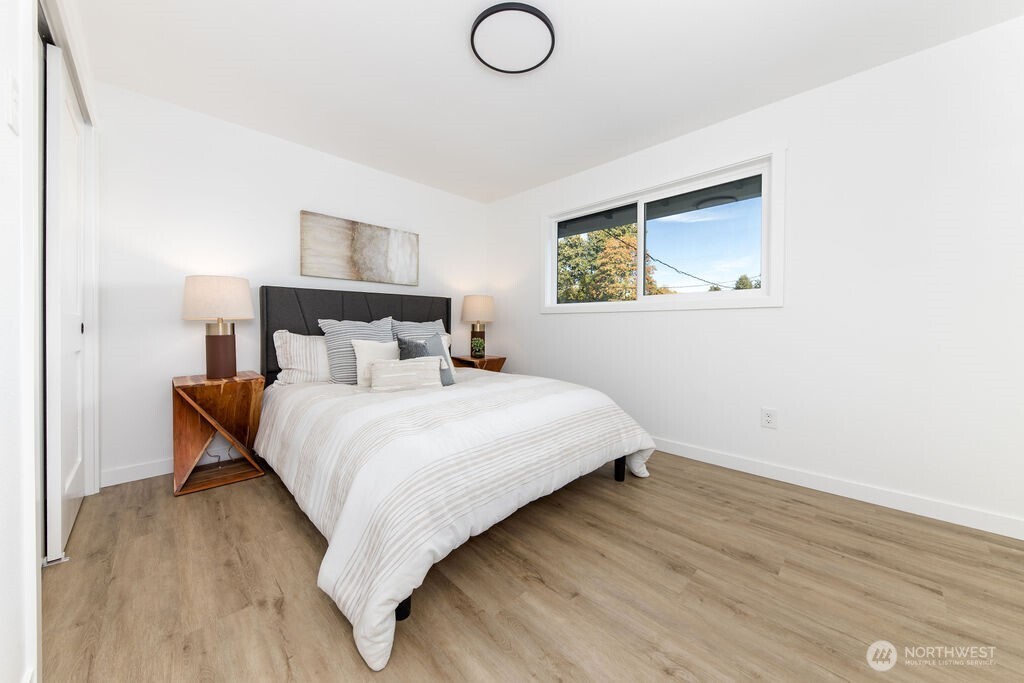 1103 Vashon Court Northeast Renton, WA 98059 - Photo 15 of 26 a bedroom with a bed and night stand