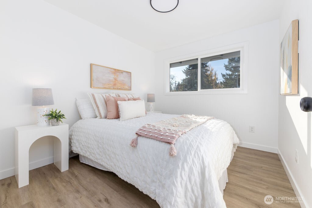 1103 Vashon Court Northeast Renton, WA 98059 - Photo 16 of 26 a bedroom with a bed and a window