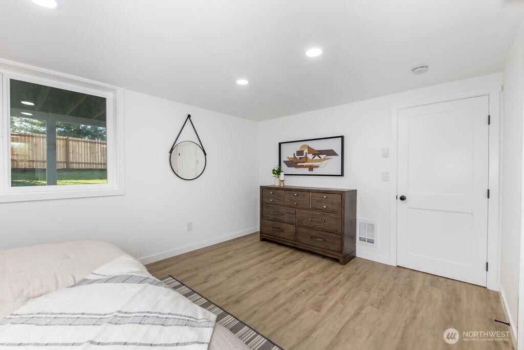 1103 Vashon Court Northeast Renton, WA 98059 - Photo 20 of 26 a bedroom with a bed and a dresser